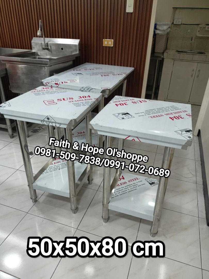 SUS 304 Stainless Steel Work Table Kitchen Prep (Category: Tables & Sets) located in Manila. Submitted by jamfrimzy089458 (Listing ID 1466832316, Image 3). Description: - Material: Heavy-duty SUS 304 stainless steel - Design: Multi-tier with a sturdy bottom shelf for extra storage - Condition: Brand new, protective film still attached - Ideal For: Commercial kitchens, food prep spaces, or garage workshops - Features: Solid build quality and very 