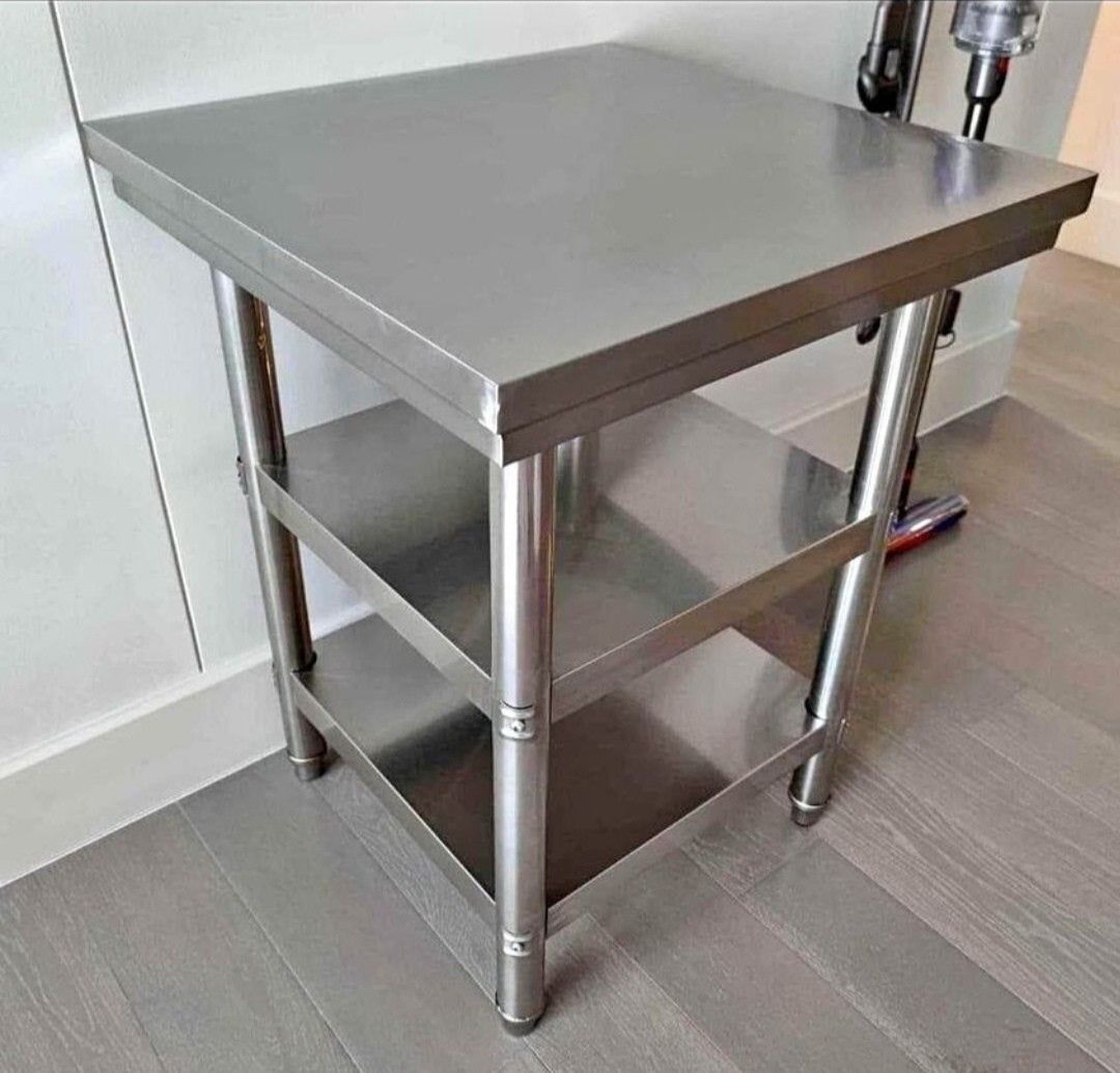 SUS 304 Stainless Steel Work Table Kitchen Prep (Category: Tables & Sets) located in Manila. Submitted by jamfrimzy089458 (Listing ID 1466832316, Image 2). Description: - Material: Heavy-duty SUS 304 stainless steel - Design: Multi-tier with a sturdy bottom shelf for extra storage - Condition: Brand new, protective film still attached - Ideal For: Commercial kitchens, food prep spaces, or garage workshops - Features: Solid build quality and very 