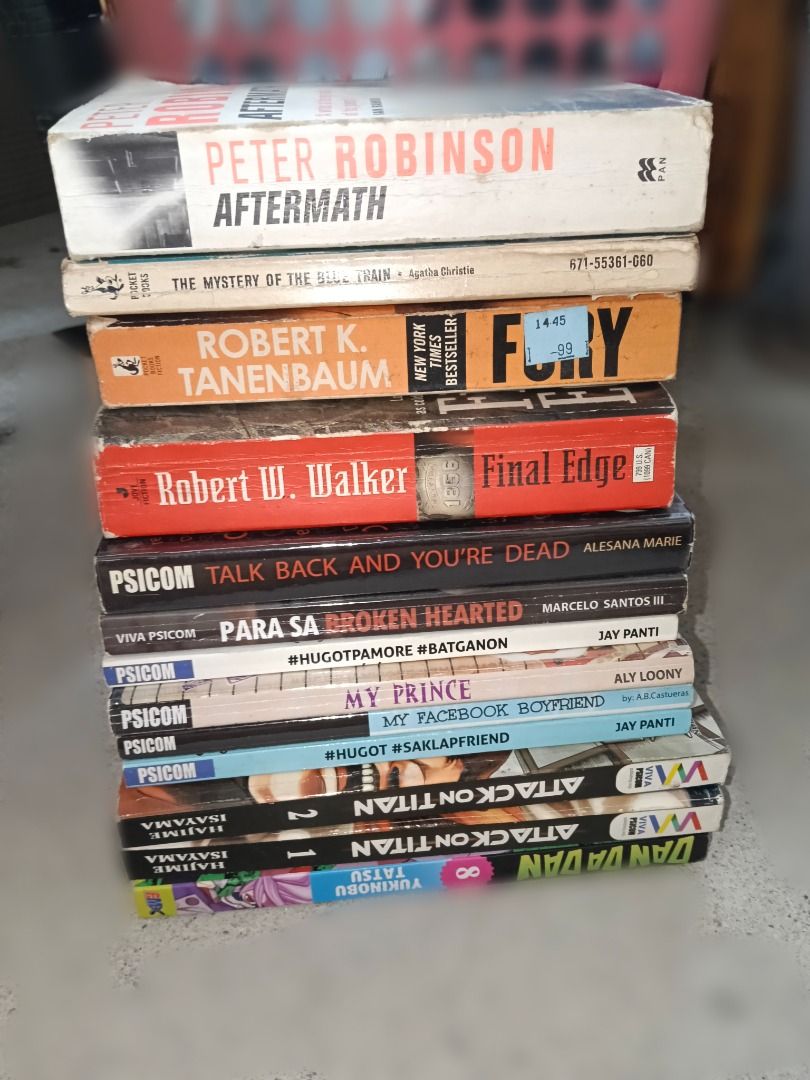 Take all 150!! (Category: Storybooks) located in Taytay. Submitted by fastphoenix_c87bb3 (Listing ID 1466889480, Image 1). Description: - Mixed book bundle pack available - Genres: Thrillers, romance novels, and manga - Includes titles like Attack on Titan and Dandadan - Authors include Peter Robinson, Robert Tanenbaum, and Jay Panti - Condition: Some shelf wear on spines and edges - Selling as a complete set only - grab them before they're gone!