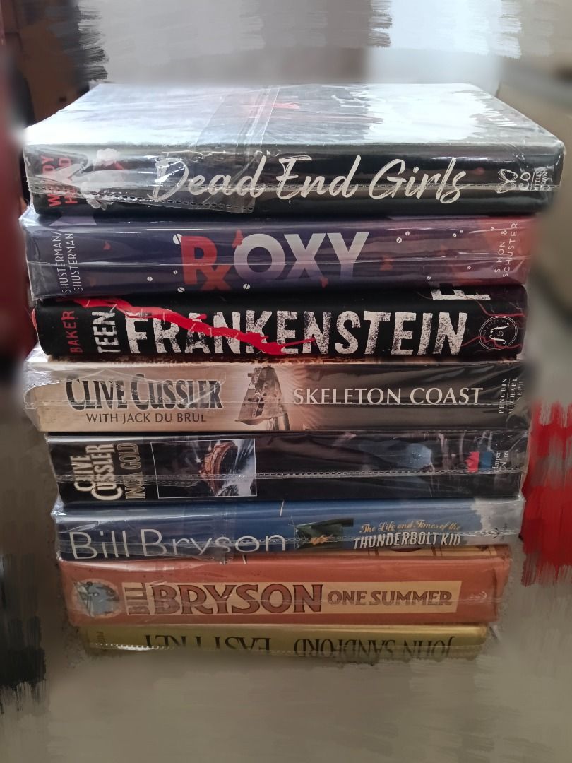 TAKE ALL PRICE Books 150!!Bundle (Category: Storybooks) located in Taytay. Submitted by fastphoenix_c87bb3 (Listing ID 1466889339, Image 1). Description: - Lot of 8 hardcover and paperback books - Features popular titles like Dead End Girls, Roxy, Teen Frankenstein, Skeleton Coast, Inca Gold, The Life and Times of the Thunderbolt Kid, and One Summer - Written by various authors including Clive Cussler and Bill Bryson - Several volumes still seale
