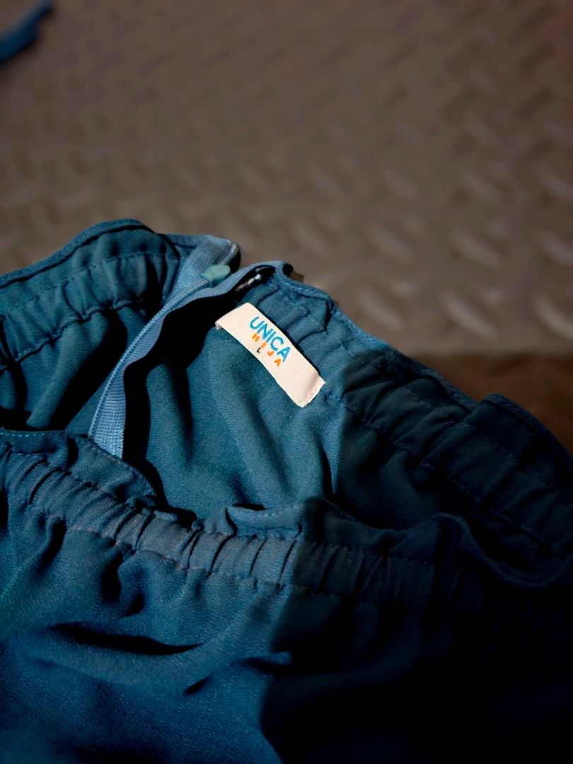 Teal and patterned blue jumpsuit size large (Category: Jumpsuits) located in Lapu Lapu. Submitted by goodstuff_cebu (Listing ID 1466948757, Image 2). Description: - Size: Large (as shown in photo) - Style: Easy pull-on design - Top: Teal with off-shoulder sleeves and string ties - Bottom: Dark blue with circular geometric patterns - Waist: Elastic waistband for a flattering gathered look - unused extra dress (pants style).