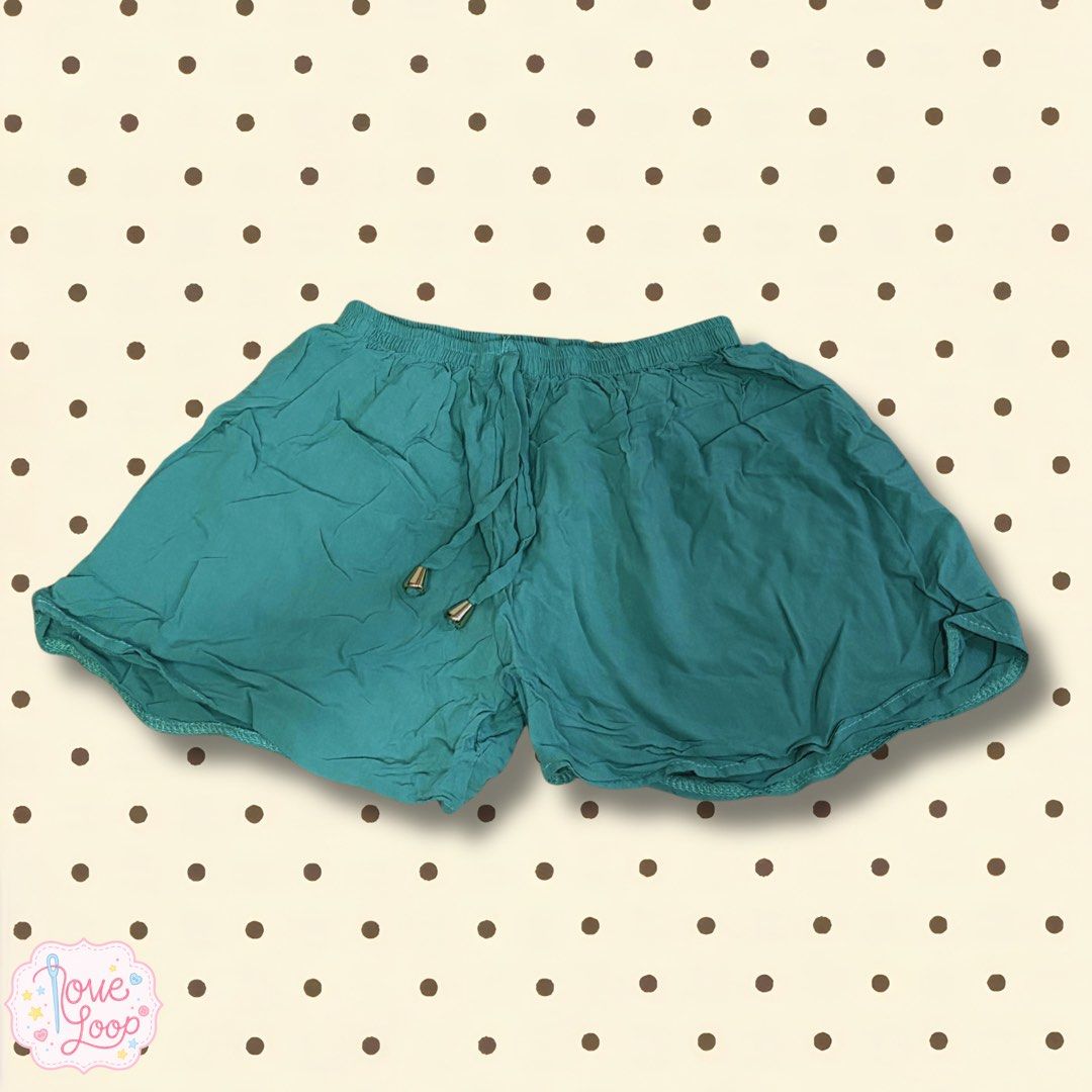 Teal green casual shorts with drawstring (Category: Shorts) located in Manila. Submitted by love.loop (Listing ID 1466890007, Image 1). Description: - Color: Teal green - Waist: Elasticated waistband with matching drawstring and chic gold metal tips - Fit: Relaxed fit with slightly flared legs for ultimate comfort - Material: Soft, breathable cotton/rayon - Style: Easy pull-on style, perfect for lounging or casual outings.
