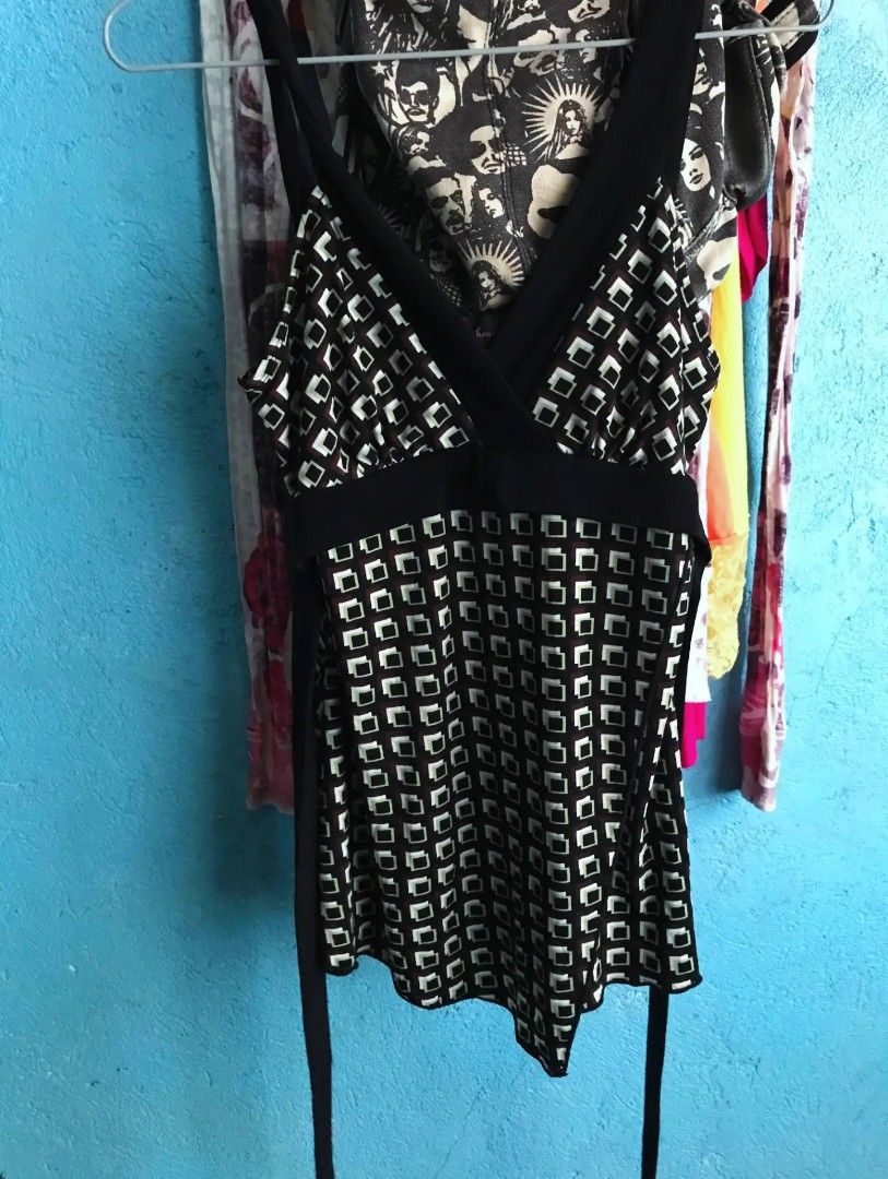 Tempted Hearts Geometric Print Tank Top (Category: Sleeveless) located in Alaminos. Submitted by elysian_thrifts (Listing ID 1466965018, Image 2). Description: - Style: Retro geometric square pattern in brown, black, and light green - Design: V-neck, solid black under-bust band, and unique asymmetrical longer hem on one side - Fabric: Lightweight and comfortable for PH weather - Versatility: Easy to dress up or down with jeans or skirts - Mode of