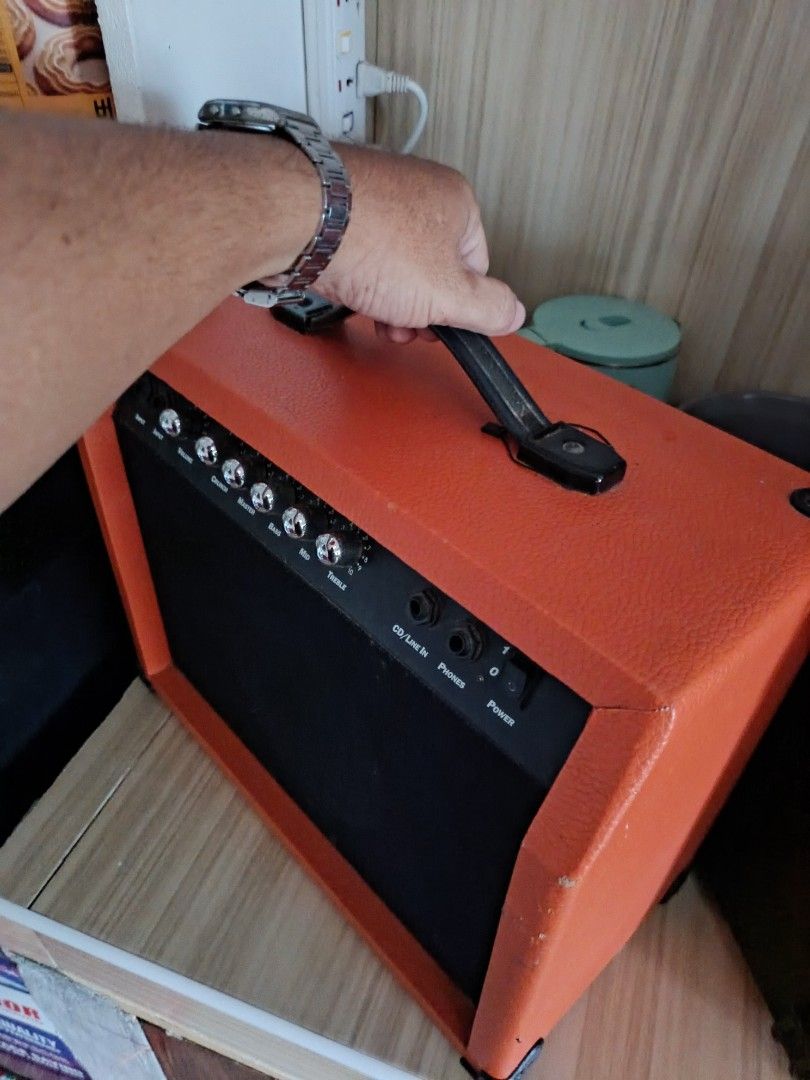TG-30 Electric Guitar Amplifier Orange (Category: Musical Instruments) located in Rizal. Submitted by richraven539699 (Listing ID 1466806241, Image 1). Description: - Model: TG-30 Guitar Amplifier in a striking vibrant orange wrap - Controls: Front panel features volume, crunch, master, bass, mid, and treble - Connectivity: Instrument input, CD/line-in, and headphone jacks - Power: Standard power switch on the right side; AC 220V-240V 50Hz input 