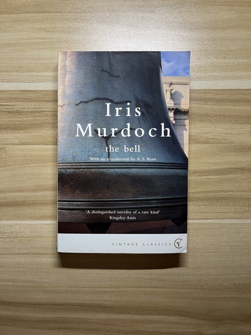 The Bell by Iris Murdoch (Category: Storybooks) located in Quezon City. Submitted by ekrudieter (Listing ID 1466832993, Image 1). Description: Paperback copy of The Bell by Iris Murdoch, part of the Vintage Classics fiction series. Includes an introduction by A. S. Byatt. Shows minor shelf wear along the edges. Spine remains intact with legible text. Clean pages inside without marks..