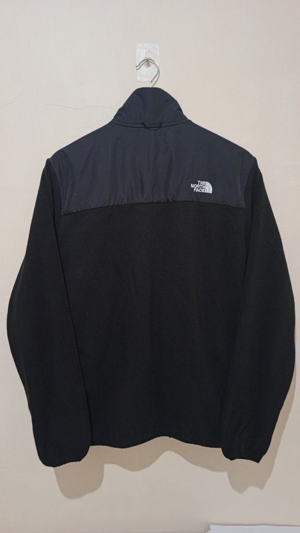 The North Face Black Fleece Jacket (Category: Coats, Jackets and Outerwear) located in Manila. Submitted by reysfindsph (Listing ID 1466935292, Image 2). Description: - Brand: The North Face - Style: Black fleece jacket with contrasting upper yoke - Size: US Men's L (Asia XL) - Features: Full zip closure, high collar, embroidered chest and back shoulder branding - Condition: Super warm layering piece for chilly days - Origin: Made in Vietnam.