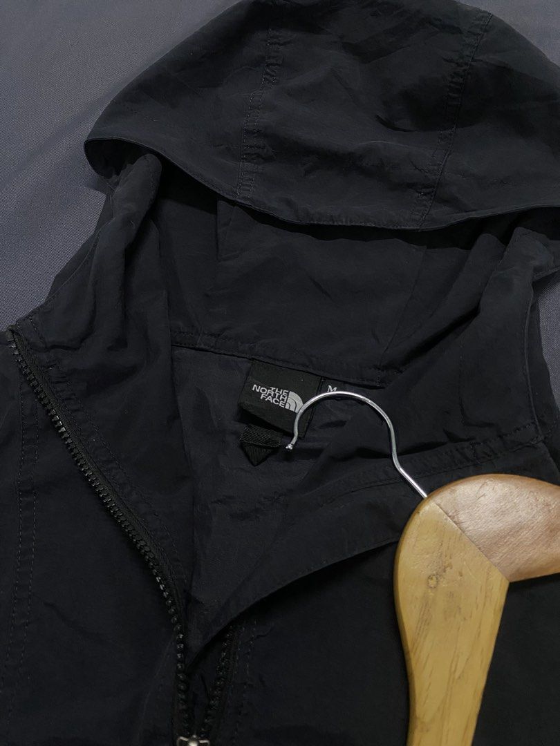 The North Face Black Nylon Windbreaker Jacket (Category: Coats, Jackets and Outerwear) located in Santa Maria. Submitted by saintarchive316 (Listing ID 1466889384, Image 3). Description: - Brand: The North Face - Model: NP21230 - Size: Medium - Color: Solid Black with subtle white logo - Material: 100% Nylon (lightweight & packable) - Features: Full zip front, attached hood, adjustable drawstrings at hood and hem, velcro cuffs, and Green Cycle in