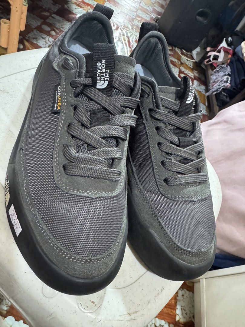 The North Face hiking shoes (Category: Flats & Sandals) located in Manila. Submitted by wildbear.e10374 (Listing ID 1466798329, Image 2). Description: - Brand: The North Face - Color: Dark Grey - Material: Durable Cordura fabric with premium suede trim - Sole: Chunky Vibram rubber with deep lug traction for maximum grip - Comfort & Fit: Padded collar, sturdy laces, and heel pull tabs for easy wear - Condition: Excellent outdoor footwear, perfect 