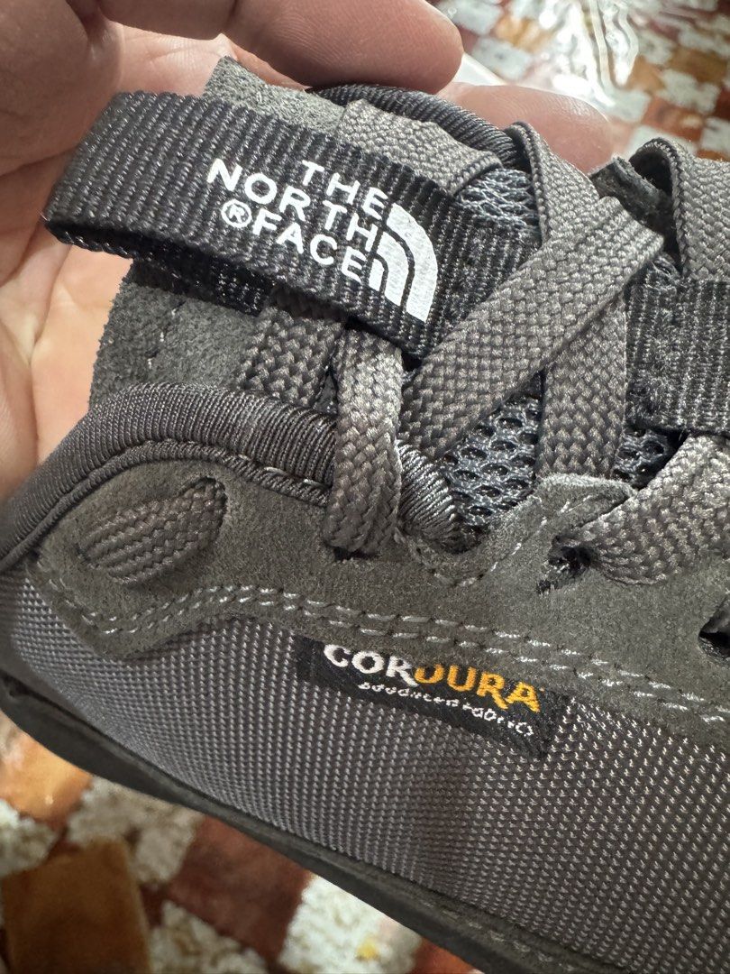 The North Face hiking shoes (Category: Flats & Sandals) located in Manila. Submitted by wildbear.e10374 (Listing ID 1466798329, Image 1). Description: - Brand: The North Face - Color: Dark Grey - Material: Durable Cordura fabric with premium suede trim - Sole: Chunky Vibram rubber with deep lug traction for maximum grip - Comfort & Fit: Padded collar, sturdy laces, and heel pull tabs for easy wear - Condition: Excellent outdoor footwear, perfect 