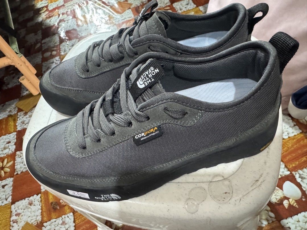 The North Face hiking shoes (Category: Flats & Sandals) located in Manila. Submitted by wildbear.e10374 (Listing ID 1466798329, Image 3). Description: - Brand: The North Face - Color: Dark Grey - Material: Durable Cordura fabric with premium suede trim - Sole: Chunky Vibram rubber with deep lug traction for maximum grip - Comfort & Fit: Padded collar, sturdy laces, and heel pull tabs for easy wear - Condition: Excellent outdoor footwear, perfect 