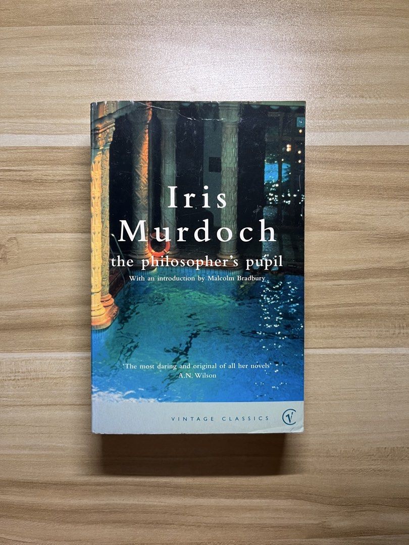 The Philosopher's Pupil by Iris Murdoch (Category: Storybooks) located in Quezon City. Submitted by ekrudieter (Listing ID 1466831156, Image 1). Description: - Title: The Philosopher's Pupil by Iris Murdoch - Edition: Vintage Classics (Includes introduction by Malcolm Bradbury) - Format: Paperback - Condition: Standard reading copy with age spots along the edges, and light shelf wear with minor creases at the spine and corners - Perfect affordabl