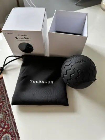Theragun Wave Solo vibrating massage ball (Category: Massage Devices) located in Rizal. Submitted by matchapeppernacho (Listing ID 1466776550, Image 1). Description: - Brand: Theragun Wave Solo vibrating massage ball - Condition: Great working condition, powers on perfectly - Benefits: Ideal for targeting deep muscle tension and stubborn knots - Design: Textured surface ensures a secure grip while rolling - Inclusions: Original box, black drawstr
