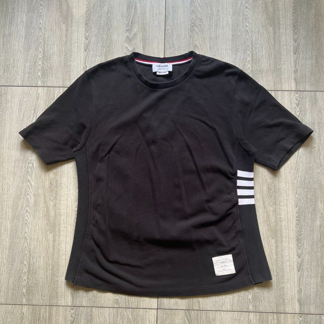 Thom Browne - Black Shirt (Category: Luxury Apparel) located in Angeles City. Submitted by sselects_ (Listing ID 1466791348, Image 1). Description: Details of the item: *Color may vary due to lighting Size: fits M imo Width: 20” Length: 25” Issue: None Condition: Excellent ALL ITEMS ARE NEGOTIABLE .