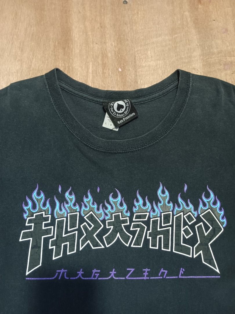 Thrasher Flame Graphic Black T-Shirt (Category: Tshirts & Polo Shirts ) located in Bulacan. Submitted by ken2thrift (Listing ID 1466806108, Image 3). Description: - Color: Black - Design: Blue flame graphic across the chest - Fit: Standard casual fit - Measurements (laid flat): Pit to pit - 20 inches | Length - 29 inches - Condition: Good - Mode of Payment: GCash - Shipping: Via LALAMOVE, J&T or LBC (Buyer shoulders fee).