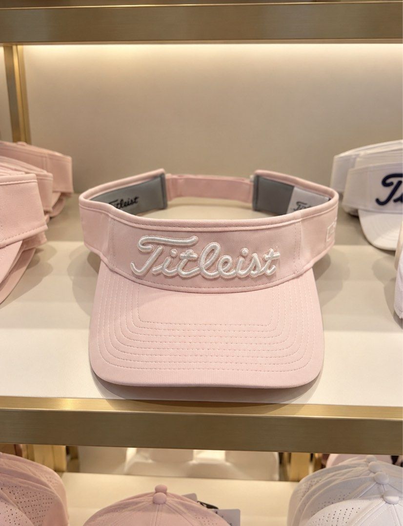 Titleist Tour Performance Visor Pale Pink / White (Category: Golf) located in Taytay. Submitted by kylalm (Listing ID 1466943741, Image 1). Description: - Brand new with original store tags attached - Authentic Titleist tour performance visor - Pale pink and white colorway - Embroidered Titleist logo on the front - Pro V1 embroidery on the side - Adjustable strap with a red-bordered Titleist tag at the back.