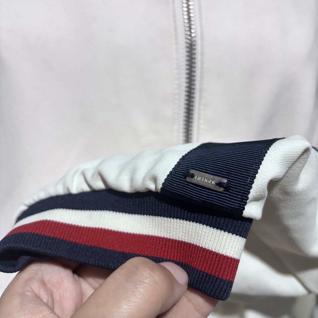 Tommy Hilfiger Bomber white jacket (Category: Coats, Jackets and Outerwear) located in Taguig. Submitted by eladela.closet (Listing ID 1466816868, Image 2). Description: size L but fits s to m yellowing on the neck part but can be bleached not my style anymkre.