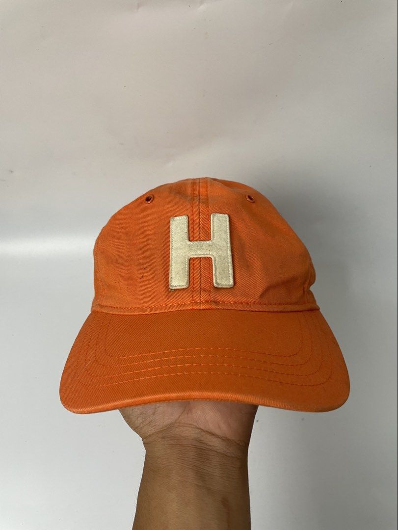 Tommy Hilfiger Orange H Logo Cap (Category: Caps & Hats) located in Manila. Submitted by rdtp2 (Listing ID 1466939517, Image 1). Description: no flaw good conditio 9/10.