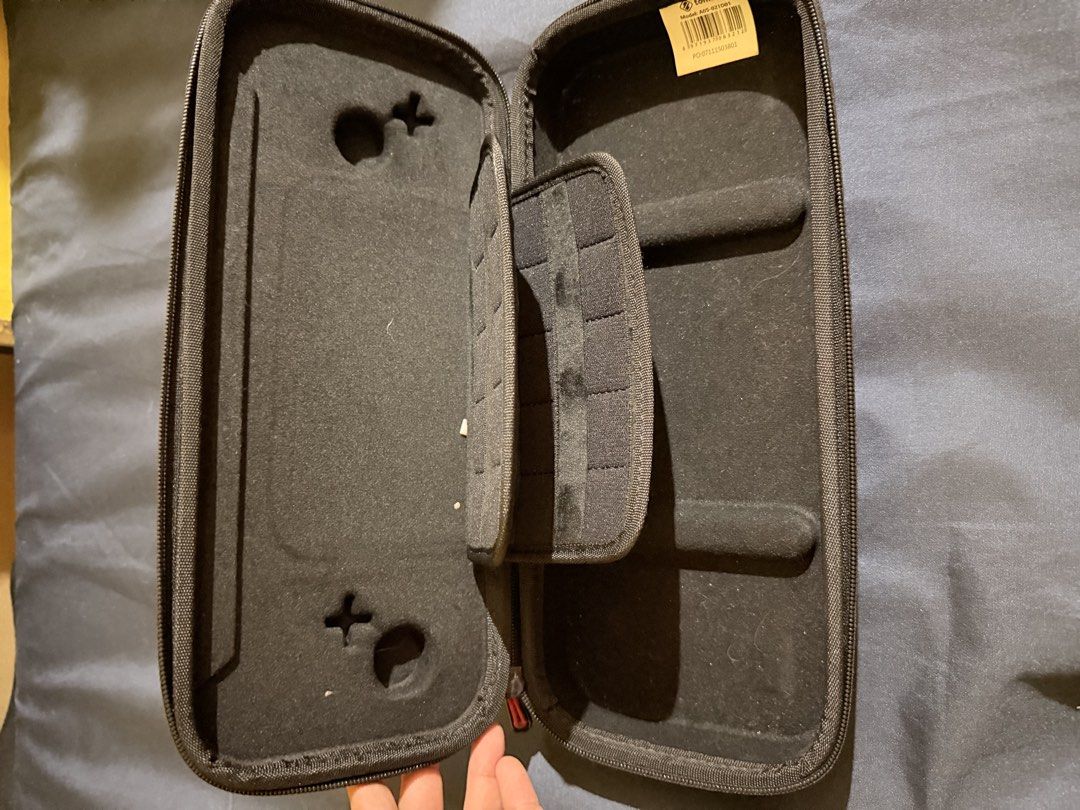 Tomtoc Hard Shell Carrying Case for Nintendo Switch (Category: Cases & Covers) located in Caloocan City. Submitted by cjbuendia21 (Listing ID 1466963697, Image 2). Description: - Authentic Tomtoc carrying case for Nintendo Switch in sleek black - Rugged exterior with a molded shell to protect your screen and thumbsticks - Soft interior lining to prevent scratches and keep your console pristine - Built-in storage flap securely holds multiple game 