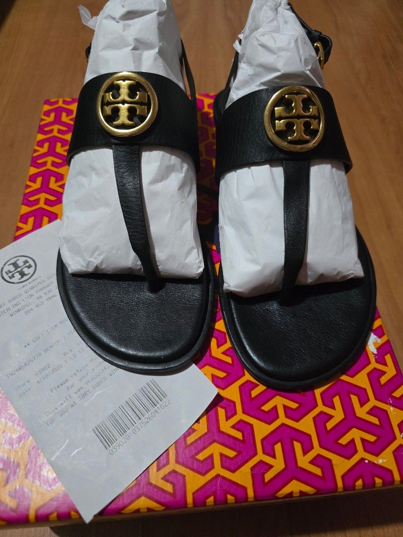 Tory Burch Benton 2 Flat Thong Sandal Black Size 7 (Category: Flats & Sandals) located in Las Pinas. Submitted by luxeprelovedstuff (Listing ID 1466870823, Image 1). Description: - Brand: Tory Burch - Model: Benton 2 flat thong sandals - Color: Perfect Black with Rolled Brass hardware - Material: Premium calf leather - Size: US 7 - Condition: Brand new, pristine, zero wear - Inclusions: Original box, packaging stuffing, and receipt.