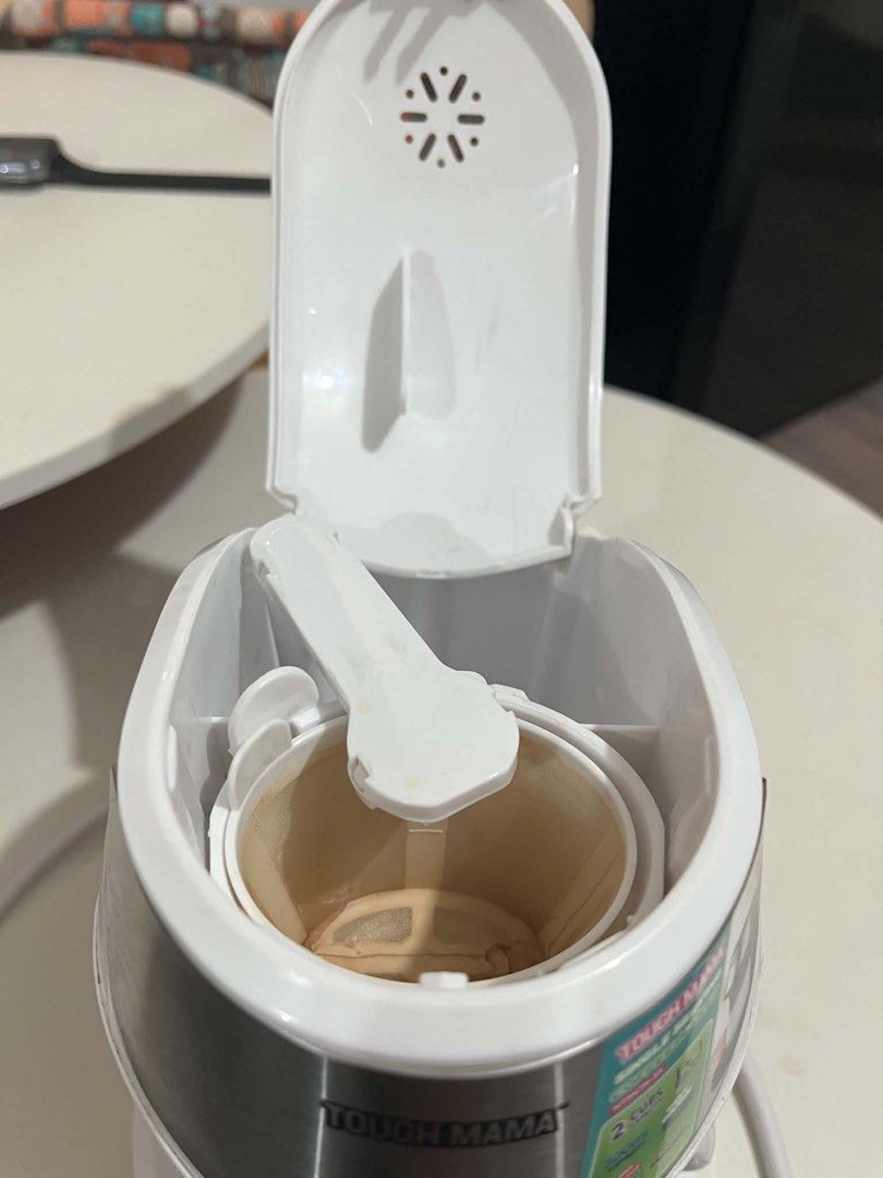 Tough Mama Single Serving Coffee Maker NTMCM-3S (Category: Coffee Machines & Makers) located in Makati City. Submitted by sneepur_14 (Listing ID 1466966735, Image 3). Description: - Brand: Tough Mama - Color: White and Silver - Capacity: 300ml (brews 2 cups) - Power: 450 watts with simple on/off control - Safety: Features boil-dry protection - Inclusions: Includes a matching white ceramic cup and removable funnel - Design: Compact and space-savin