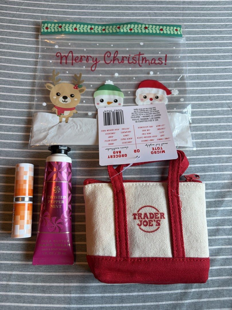 Trader Joe's Canvas Micro Tote Gift Set with Extras (Category: Tote Bags) located in Quezon City. Submitted by mmiyah27 (Listing ID 1466793100, Image 1). Description: - Brand new with tags (BNWT) Trader Joe's canvas micro tote bag with red trim, handles, and zipper closure (SKU 82352) - Includes a handy grocery bag tucked inside the tote - Bath & Body Works Twisted Peppermint shea butter hand cream (1 fl oz) - Clinique lipstick included - Beautif