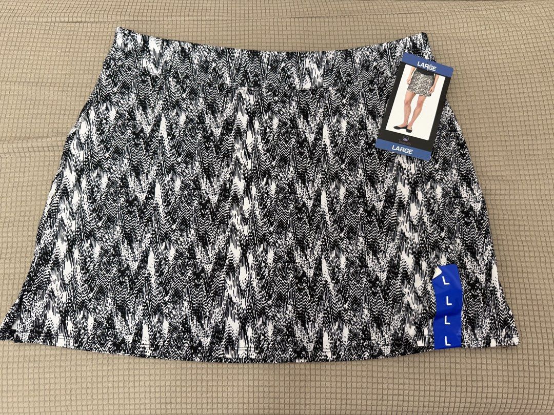 Tranquility Black White Printed Athletic Skort Size Large (Category: Activewear) located in Quezon City. Submitted by tinamartinez (Listing ID 1466871395, Image 1). Description: - Brand: Tranquility - Condition: Brand new with tags (BNWT) - Design: Black and white abstract print - Features: Built-in black shorts for extra coverage and comfort - Waistband: Wide and comfortable with printed brand/size info - Material: Polyester and spandex blend.