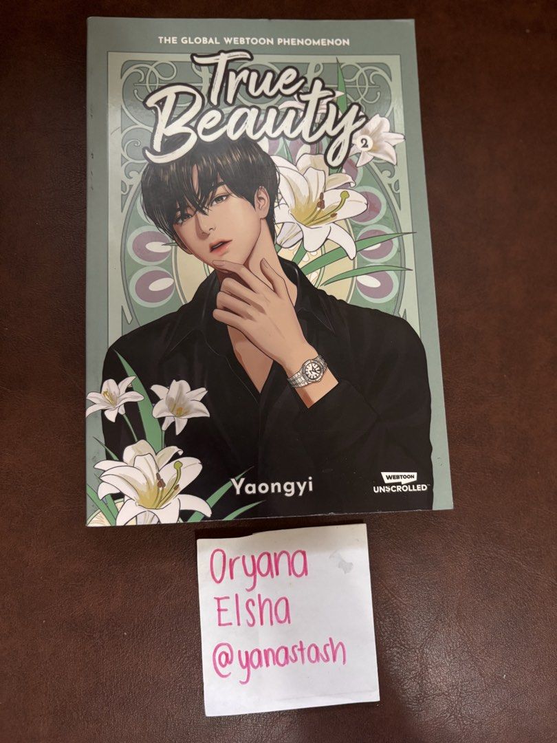 True Beauty Volume 2 by Yaongyi Webtoon Comic (Category: Comics & Manga) located in Manila. Submitted by yanastash (Listing ID 1466809869, Image 2). Description: - Title: True Beauty Volume 2 (English Edition) - Author/Artist: Yaongyi - Publisher: Unicorntrolled - Format: Softcover graphic novel - Cover Art: Suho with white lilies 💳 MOP: PAYMENT FIRST • GCash • BPI • GoTyme • MariBank 📦 SHIPPING / DELIVERY • Lalamove • GrabExpress • J&T • Other