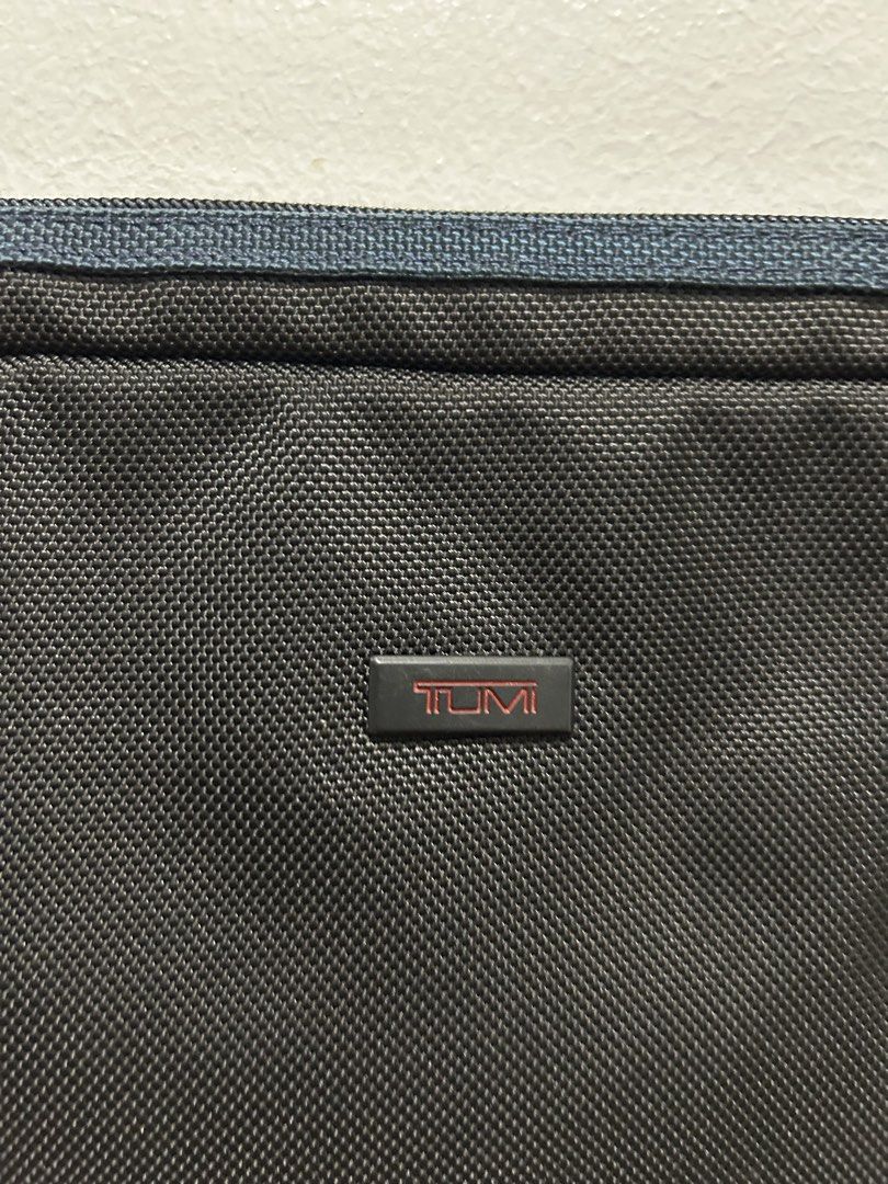 Tumi Black Laptop Sleeve Pouch (Category: Laptop Bags & Sleeves) located in Angeles City. Submitted by cassey_phoenix (Listing ID 1466906569, Image 2). Description: - Authentic Tumi laptop sleeve in classic black with blue zipper details - Padded interior safeguards your device from scratches and bumps - Built to last with durable ballistic nylon exterior for daily wear - Slim and compact design fits effortlessly into backpacks or briefcases - Fi
