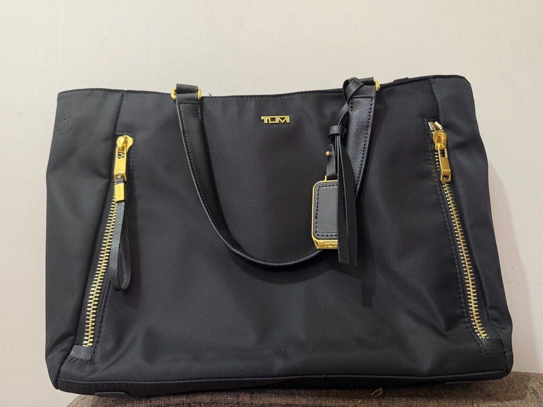 Tumi Hand bag (Category: Cross-body Bags) located in San Jose del Monte. Submitted by outfits_and_more (Listing ID 1466791493, Image 1). Description: Like new condition Used for 1 month only Fits 13inch laptop Durable and water repellant Size: Height-14” Length-16” Width-4” Last price because free shipping.