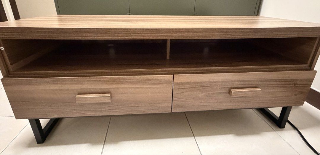 TV Console Cabinet for Sale (Category: TV Consoles) located in Pasig City. Submitted by theg3neralist (Listing ID 1466954743, Image 1). Description: • MDF wood with a steel stand • Industrial-style design • Bought from Landmark • A few scratches inside the drawer • Minor peeling on the left corner • Drawer is fully functional and works well • Shipping to be arranged and paid for by the buyer Dimensions: 120 (W) × 45 (D) × 50 (H) cm Reason for sel