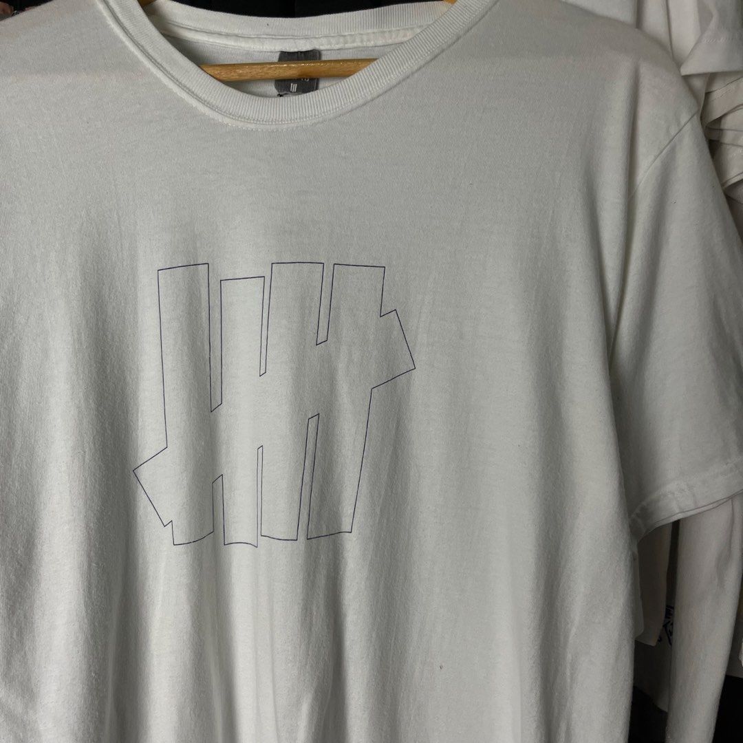 Undefeated (UNDFTD) 5-Strike logo t-shirt (Category: Tshirts & Polo Shirts ) located in Daet. Submitted by wearthriftingcloth. (Listing ID 1466920128, Image 2). Description: 👕UNDEFEATED Size:M Measurement: W21xL27 Issue(s): MINIMAL HAIRLINE Condition: 9.5/10 Color rate: 9/10 ➡️Swipe- to see more detail pic 📌No Deleting/Cancelation‼️ 📌Color may Vary Due to Lighting‼️ 📌Please be responsible buyer Bogus/Flaker will be posted‼️ 📌All ltems Need W