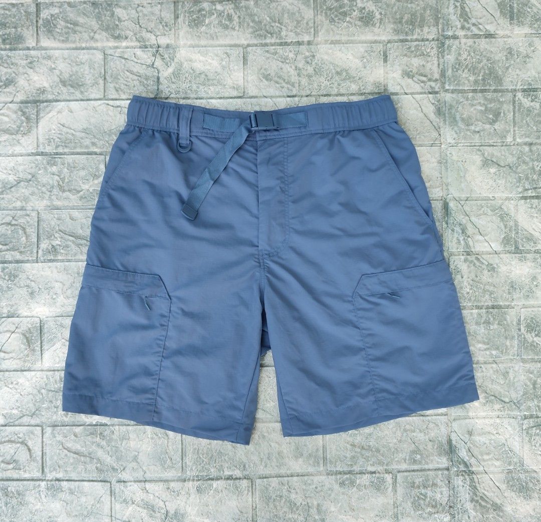 Uniqlo Nylon Utility Geared Shorts (Category: Shorts) located in Bayambang. Submitted by mon10192816 (Listing ID 1466905669, Image 1). Description: - Waist 30-33 - Length 18 - Issue - Small Scratch not visible, check last photo - Brand: Uniqlo - Color: Blue - Size: S - Material: 100% nylon body with breathable mesh lining - Features: Water-repellent finish, multiple utility pockets on sides and back, elastic waistband with adjustable integrated b