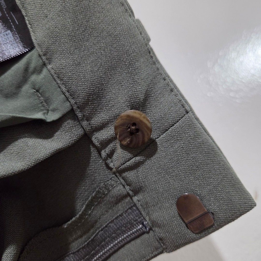 Uniqlo Tapered Pants (Category: Other Bottoms) located in San Nicolas. Submitted by mllc523 (Listing ID 1466807885, Image 3). Description: Closure: Button and hook with zip fly Pockets: Two functional back pockets Condition: Excellent, clean fabric with no stains or damage Size S, fits 25" to 26" Length: 35".