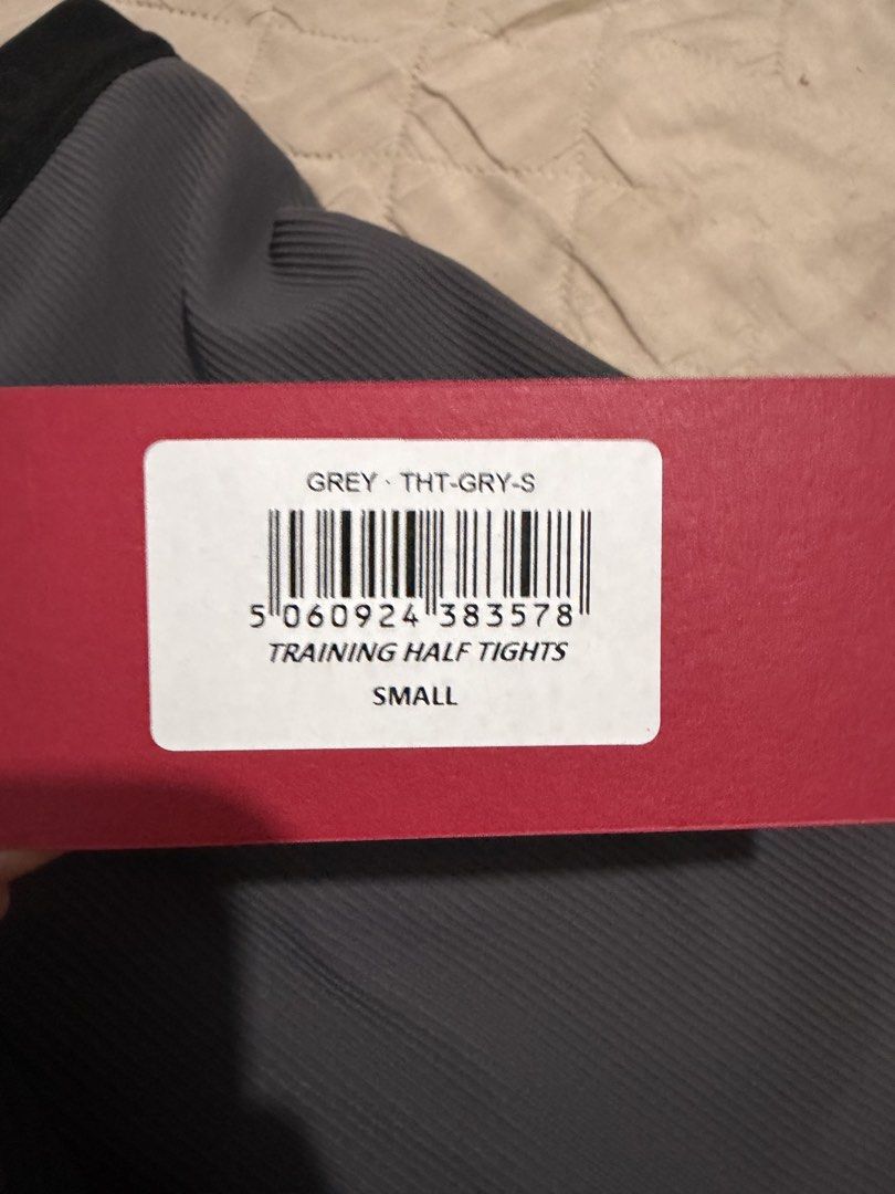 UVU V1 Half Tights Grey (Size Small) (Category: Activewear) located in Manila. Submitted by mnl.lvprdgci (Listing ID 1466886108, Image 3). Description: - Brand: UVU - Model: Training Half Tights - Color: Grey - Size: Small - Condition: Brand new with tags and original packaging - Features: Ribbed athletic fabric, elastic waistband with drawstring, printed UVU branding on the leg and back.