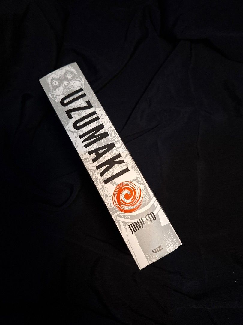 Uzumaki by Junji Ito Hardcover (Category: Comics & Manga) located in Makati City. Submitted by greycrowhouselibrary (Listing ID 1466877662, Image 2). Description: Uzumaki hardback edition by Junji Ito. Published by Viz Media Signature. Classic horror manga collecting the complete story in a single hardcover volume. Clean pages, solid binding, minimal shelf wear on the cover. Great read for horror fans and manga collectors alike..