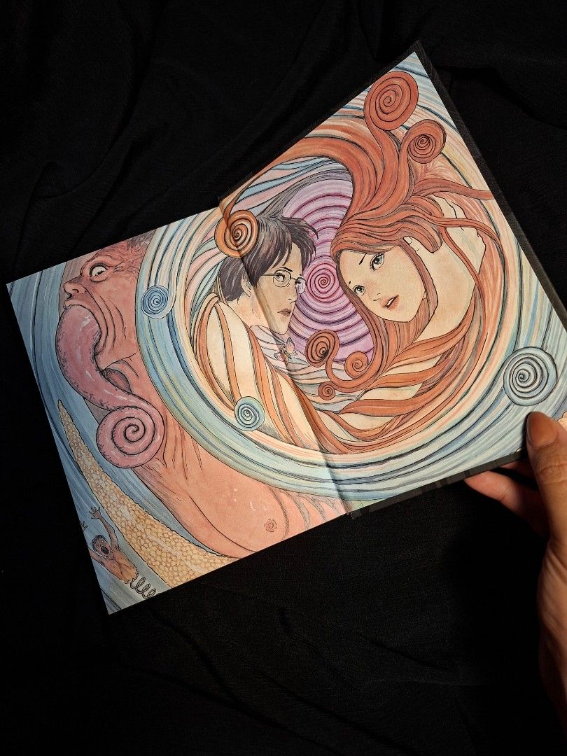 Uzumaki by Junji Ito Hardcover (Category: Comics & Manga) located in Makati City. Submitted by greycrowhouselibrary (Listing ID 1466877662, Image 3). Description: Uzumaki hardback edition by Junji Ito. Published by Viz Media Signature. Classic horror manga collecting the complete story in a single hardcover volume. Clean pages, solid binding, minimal shelf wear on the cover. Great read for horror fans and manga collectors alike..