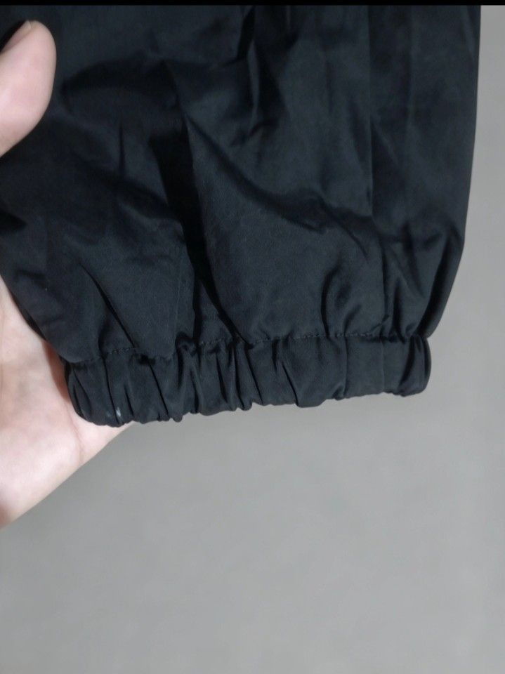 Vans Black Coach Jacket Off The Wall (Category: Coats, Jackets and Outerwear) located in Sorsogon. Submitted by tanggoal (Listing ID 1466797624, Image 3). Description: - Brand: Vans - 1,5k, Free shipping✅ - issue sa last picture📌 - Style: Black coach jacket with snap button closure and collared neckline - Design: Graphic print on left chest; large back illustration with clapperboard, 'Off The Wall' branding, and 'Tell A Friend About Vans' text -