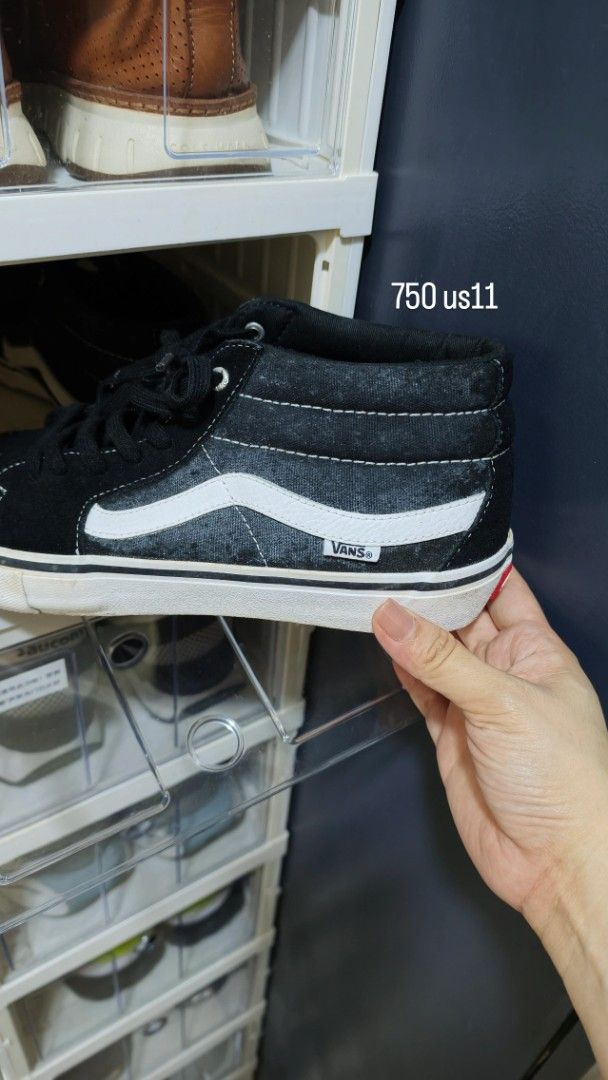 Vans Mid-Top Sneakers Black White US 11 (Category: Sneakers) located in Antipolo. Submitted by jarazote (Listing ID 1466814688, Image 1). Description: Black and white Vans mid-top sneakers with white side stripe and contrast stitching. Size US 11. Durable canvas and suede upper with white rubber midsole. Classic skate style, versatile everyday wear. Clean and ready for a new owner..