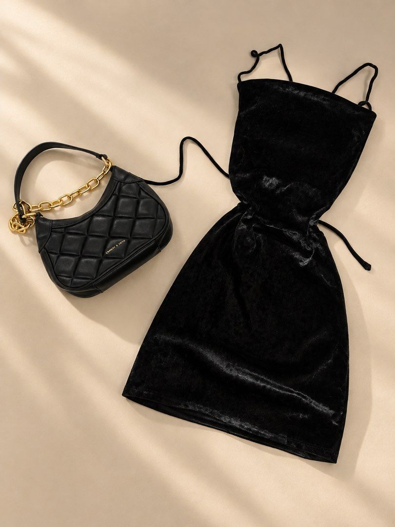 Velvet dresses (get2) (Category: Dresses) located in Manila. Submitted by unicahija24 (Listing ID 1466870717, Image 2). Description: - Charles & Keith black quilted shoulder bag with chunky gold chain - Includes 2 velvet dresses in black and mauve pink - Ready-to-wear outfit combination for parties and nights out - Selling as a complete set - Condition: Excellent.