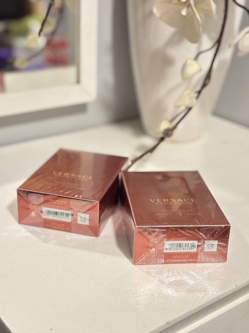 Versace Eros Flame Eau de Parfum 100ml (Category: Fragrance & Deodorants) located in Taguig. Submitted by cheolito0000 (Listing ID 1466845271, Image 2). Description: - Brand: Versace Eros Flame Eau de Parfum - Quantity: 1 box (100ml / 3.4 US fl. oz. each) - Condition: Brand new, still sealed in original plastic wrapping - Details: Natural spray, Euroitalia distribution, striking red packaging with gold lettering and embossed Medusa logo - Perfect