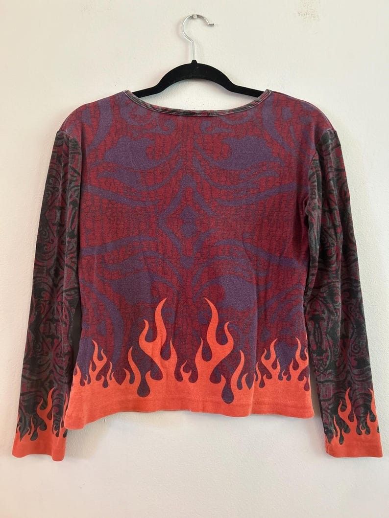 Vintage 00s Harley Davidson AOP Flame & Eagle Design* (Category: Longsleeves) located in Cabuyao City. Submitted by roronhilira (Listing ID 1466968450, Image 3). Description: Vintage 00s Harley Davidson AOP Flame & Eagle Design* Women Tops 2W size tag 23 pit to pit 26 length very good condition 1200 shipped DM 📥.