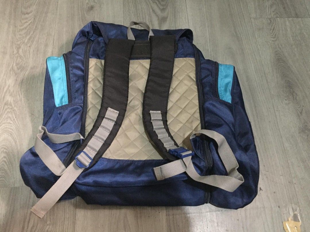 Vintage Blue and Teal Adidas Backpack (Category: Backpacks) located in General Santos City (Dadiangas). Submitted by loloikoh63127 (Listing ID 1466800177, Image 2). Description: - Dark blue Adidas backpack featuring vibrant teal accents and a large vintage logo on the front pocket - Comfortable padded tan back panel with stylish quilted diamond stitching - Multiple zippered compartments and side pockets to keep your essentials organized - Adjusta