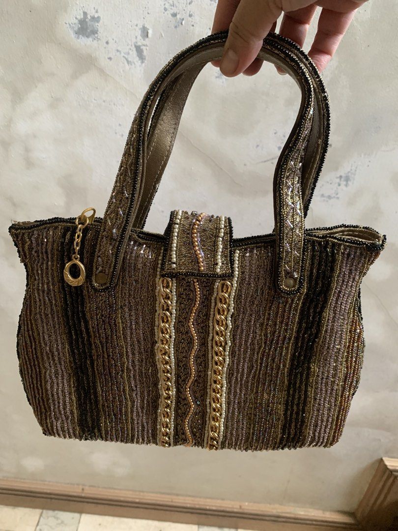 Vintage Metallic Gold Beaded Handbag with Chains (Category: Purses & Pouches) located in Tarlac. Submitted by thrice.closet (Listing ID 1466854057, Image 3). Description: has minor flaws last photo for reference only.