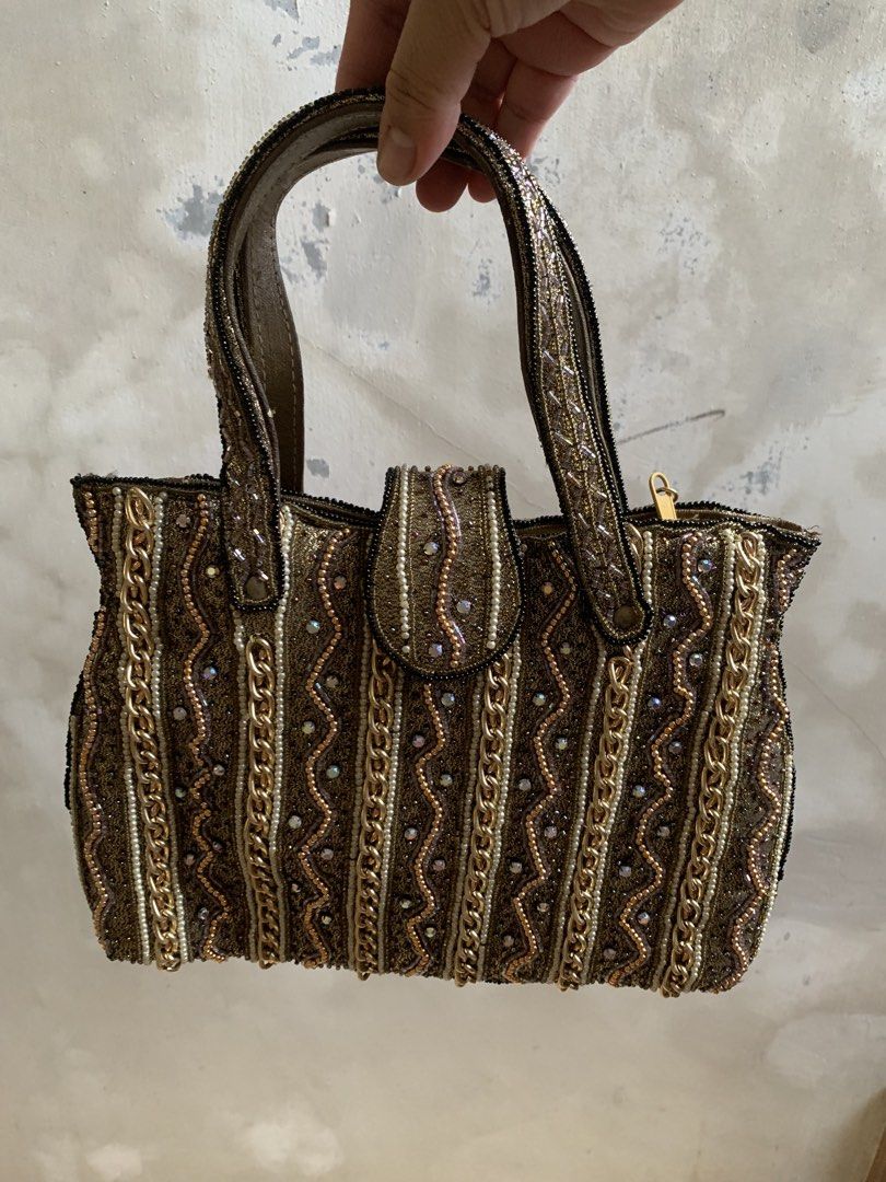 Vintage Metallic Gold Beaded Handbag with Chains (Category: Purses & Pouches) located in Tarlac. Submitted by thrice.closet (Listing ID 1466854057, Image 1). Description: has minor flaws last photo for reference only.