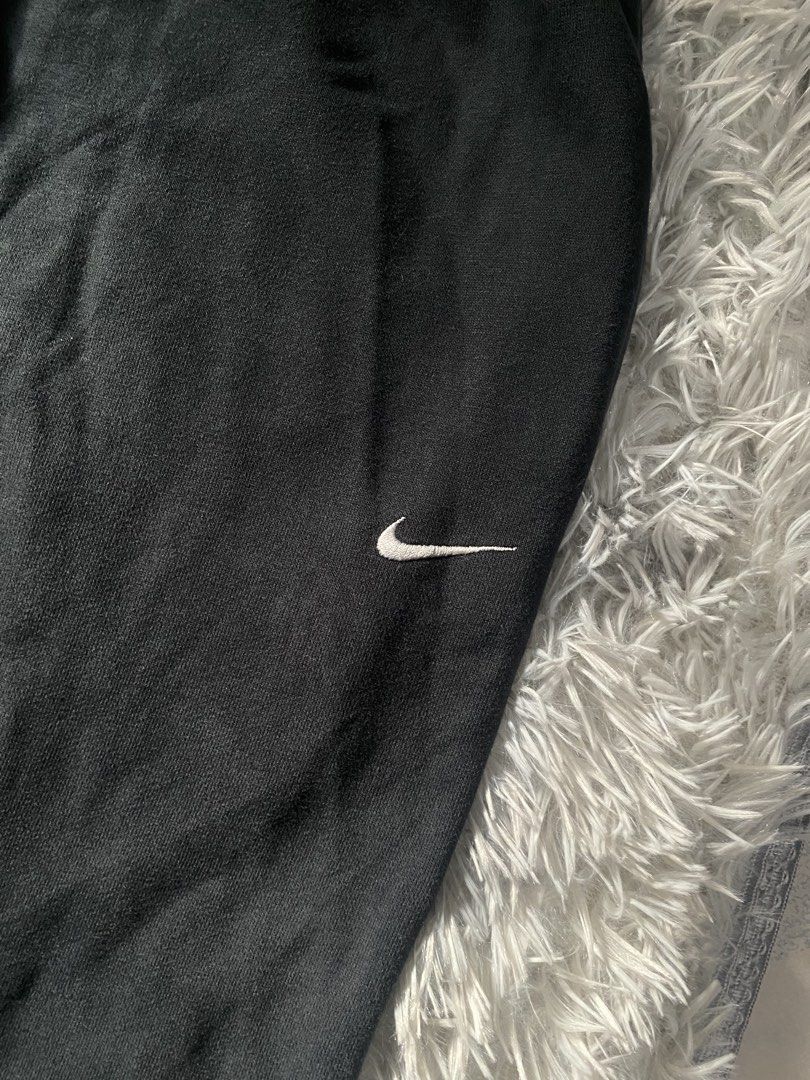 Vintage Nike Black Sweatpants Drawstring Joggers (Category: Joggers) located in Mendez-Nunez. Submitted by leighthrift (Listing ID 1466892234, Image 2). Description: NIKE VINTAGE SWEATPANTS DIMES: WAIST: OSFA ( ONE SIZE FITS ALL ) LENGTH: 40 THIGH: 15 HEM: 10 ISSUE: LINTS - Vintage 2006 Nike sweatpants (verified via inside wash tag) - Color: Classic Black - Fit: Relaxed fit through the legs with an adjustable drawstring waist - Branding: Iconic e