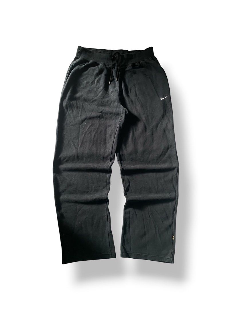 Vintage Nike Black Sweatpants Drawstring Joggers (Category: Joggers) located in Mendez-Nunez. Submitted by leighthrift (Listing ID 1466892234, Image 1). Description: NIKE VINTAGE SWEATPANTS DIMES: WAIST: OSFA ( ONE SIZE FITS ALL ) LENGTH: 40 THIGH: 15 HEM: 10 ISSUE: LINTS - Vintage 2006 Nike sweatpants (verified via inside wash tag) - Color: Classic Black - Fit: Relaxed fit through the legs with an adjustable drawstring waist - Branding: Iconic e