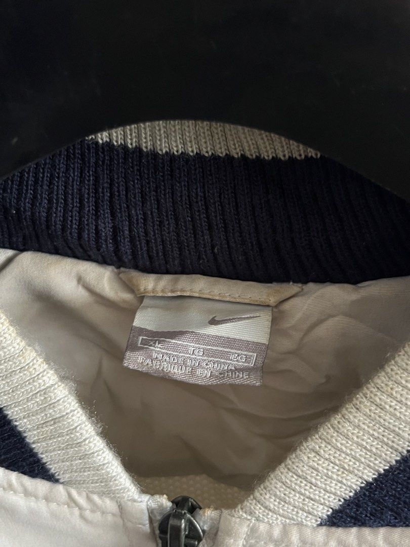 Vintage Nike Bomber Jacket (Category: Coats, Jackets and Outerwear) located in Virac. Submitted by _thecave (Listing ID 1466834408, Image 3). Description: Vintage Nike Bomber Jacket Excellent Stains (normal due to age) Tagged Size: XL Width: 24 Length: 28 P750 + SF.