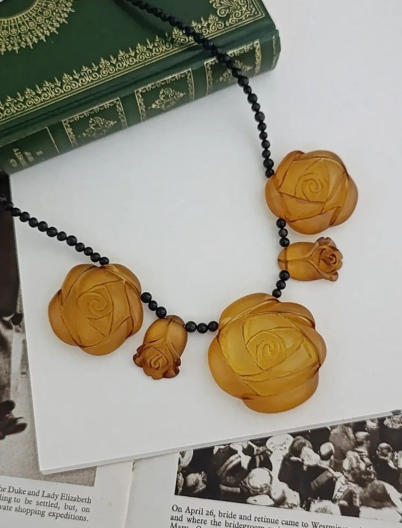 Vintage Rose Statement Necklace (Category: Necklaces) located in Gingoog City. Submitted by ThePurpleBox (Listing ID 1466962299, Image 1). Description: Vintage Rose Statement Necklace 1,580php✅ Stunning contrast piece featuring 5 honey-amber lucite roses strung with polished, natural black horn accent beads. Captures the light beautifully and makes a bold, elegant statement. The total length is 19.5". In good vintage condition. Disclaimer: Listed
