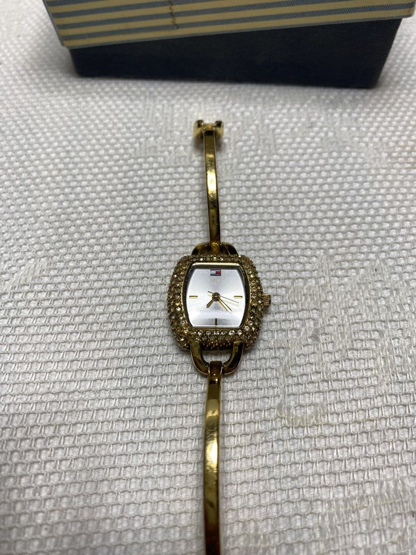 Vintage Tommy Hilfger watch (Category: Women's Watches) located in Angeles City. Submitted by noagrace (Listing ID 1466786534, Image 3). Description: Vintage Tommy Hilfiger women’s bangle-style analog watch Gold plated rhinestone crystal-set bezel Missing few crystals No battery Complete with box P1800.