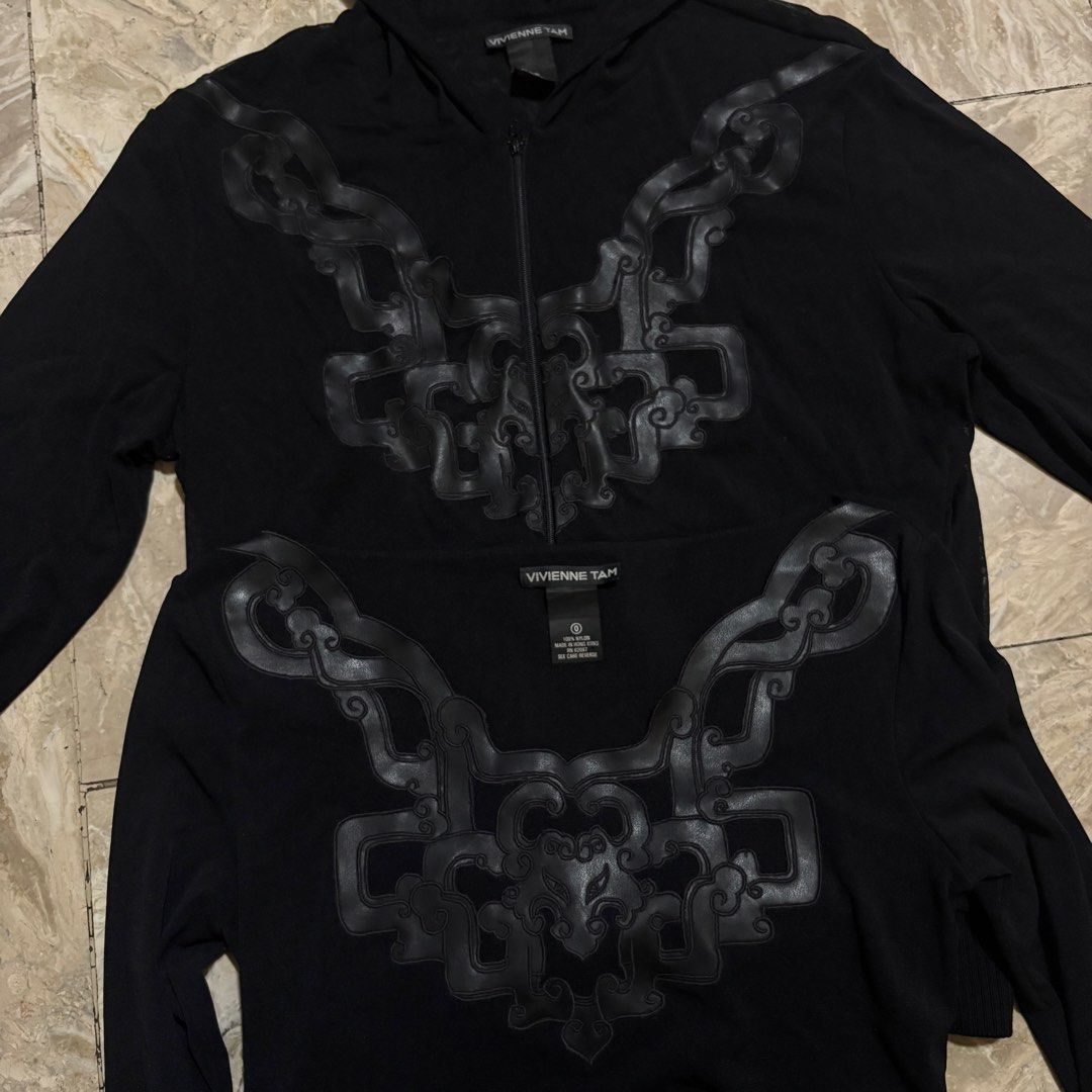 Vivienne tam Mesh (Category: Coats, Jackets and Outerwear) located in Dinalupihan. Submitted by hell.thrift (Listing ID 1466850139, Image 2). Description: Vivienne Tam black zip-up hoodie and and long sleeve ornate faux-leather or cord appliqué chest embellishment Mesh material Size:2 And Size:0 Both no issue 8,500 for both.